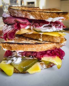 vegan pastrami in a reuben sandwich