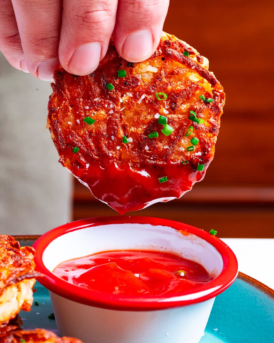 Dunking the hash brown in ketchup