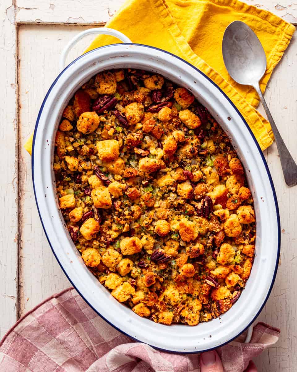 a casserole dish containing baked vegan cornbread stuffing