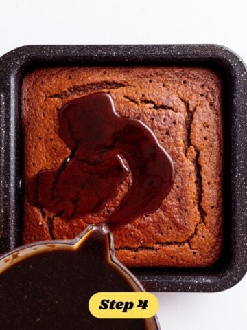 Step 4 of the vegan pumpkin sticky toffee pudding method: The toffee sauce being poured over the pudding.