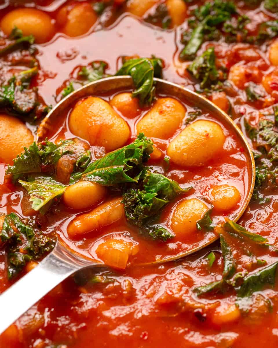A ladle of vegan butter bean stew