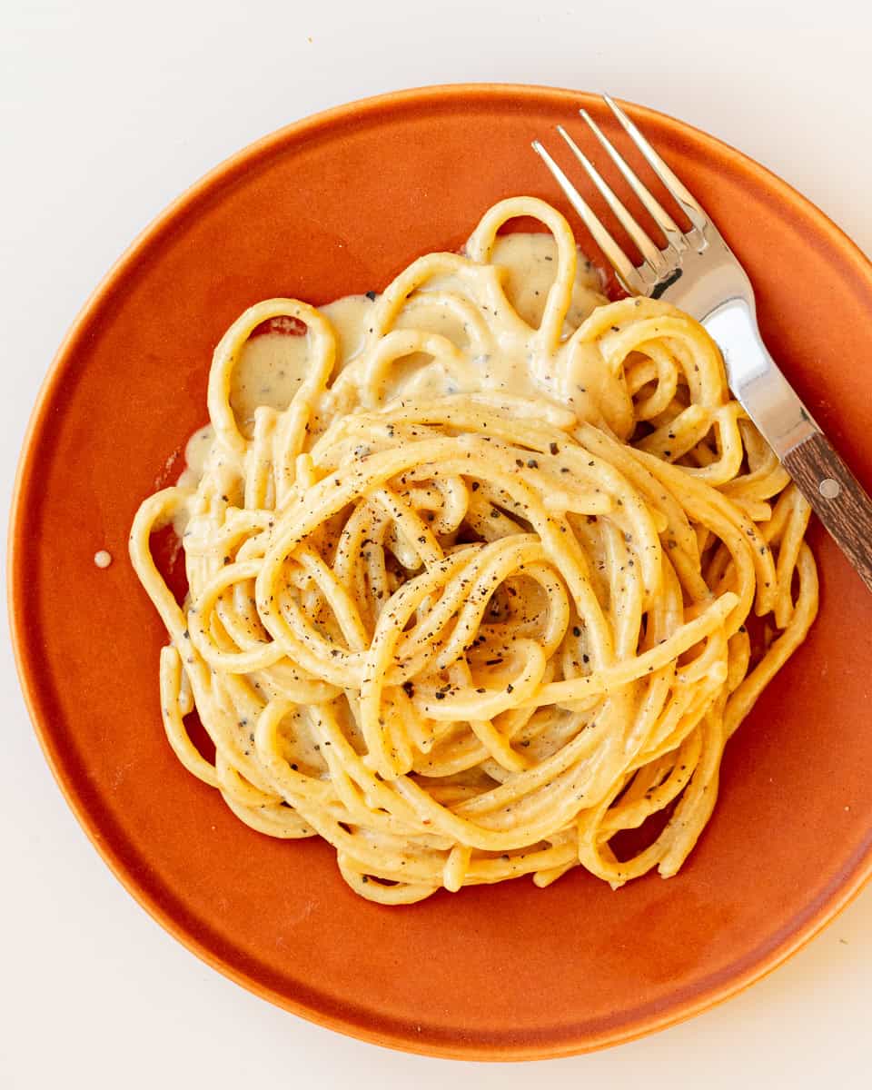 A plate of vegan cacio e pepe